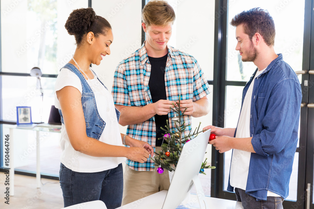 © Sergey Nivens - Young office workers discussing