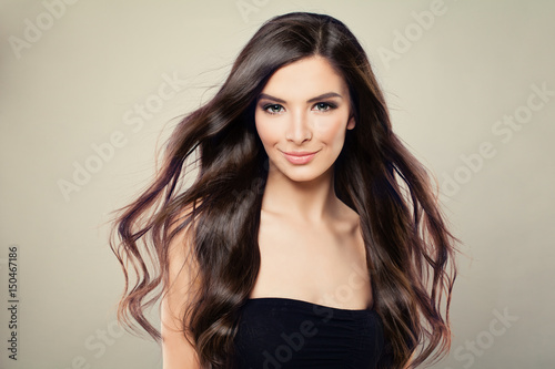 Young Hispanic Fashion Model Woman with Brown Blowing Hair and Perfect Makeup
