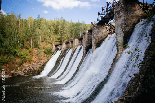 Old historic stone dam in Russia