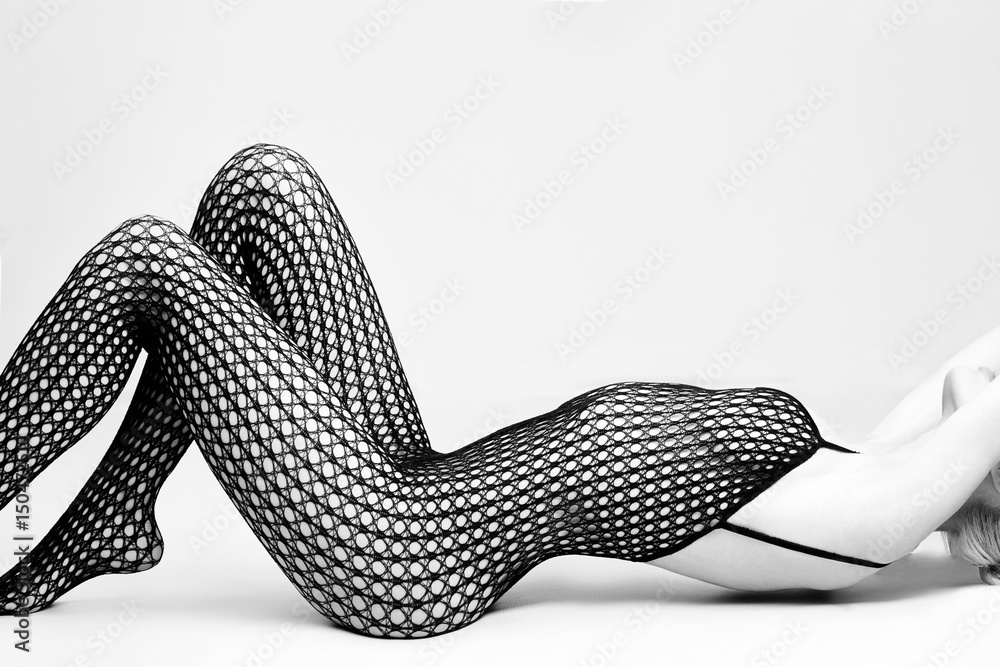 Nude woman blonde in sexy lingerie sitting on the floor. Nude perfect naked  body girls in black erotic underwear in mesh. Nude girl posing on white  background Stock Photo | Adobe Stock