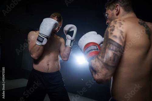 Both of boxers with guard position © gpointstudio