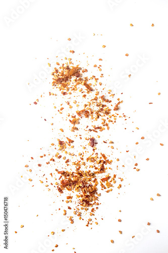 Red hot chili pepper's flakes. White background. isolated.