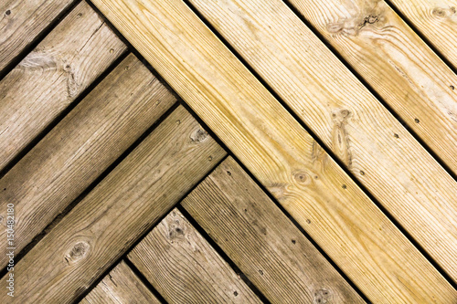 Old next to new pine boards. Abstract wooden background