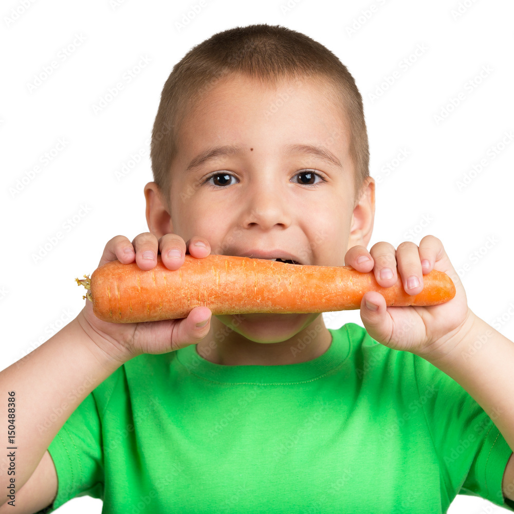 Portrait of a child with a carrot in hands Portrait of a child with a carrot in hands