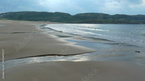 Wallpaper Mural Sea and sandy beach in the background of low rocky mountains. 

Overcast summer day. Torontodigital.ca