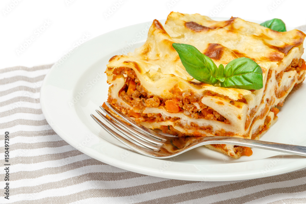 Portion of tasty lasagna isolated on white