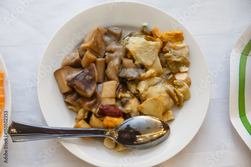 Traditional Russian dish - salted and pickled mushrooms are on the plate.