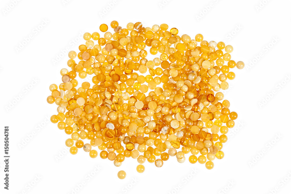 Yellow amber stones on a white background. Yellow amber stones on a white background.