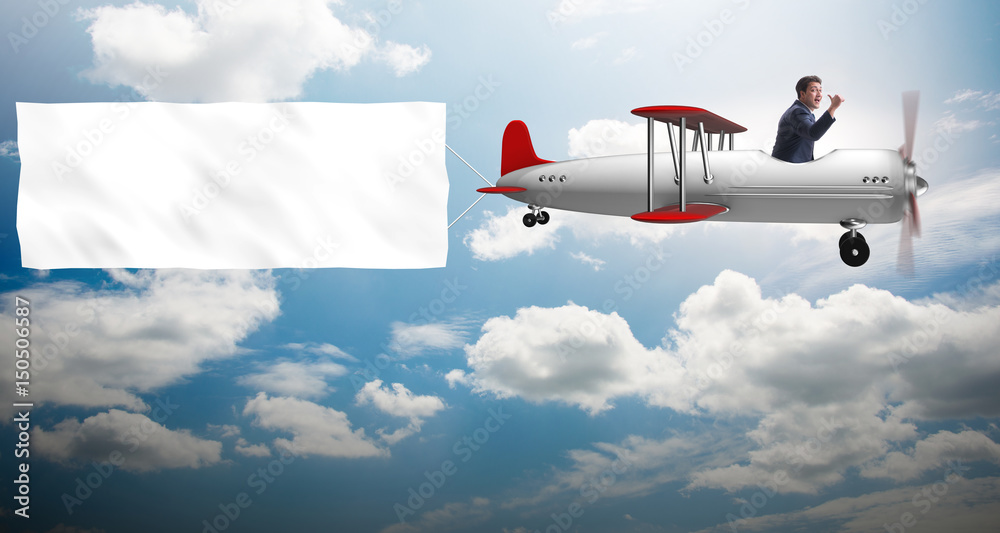 Naklejka premium Biplane with businessman and blank banner
