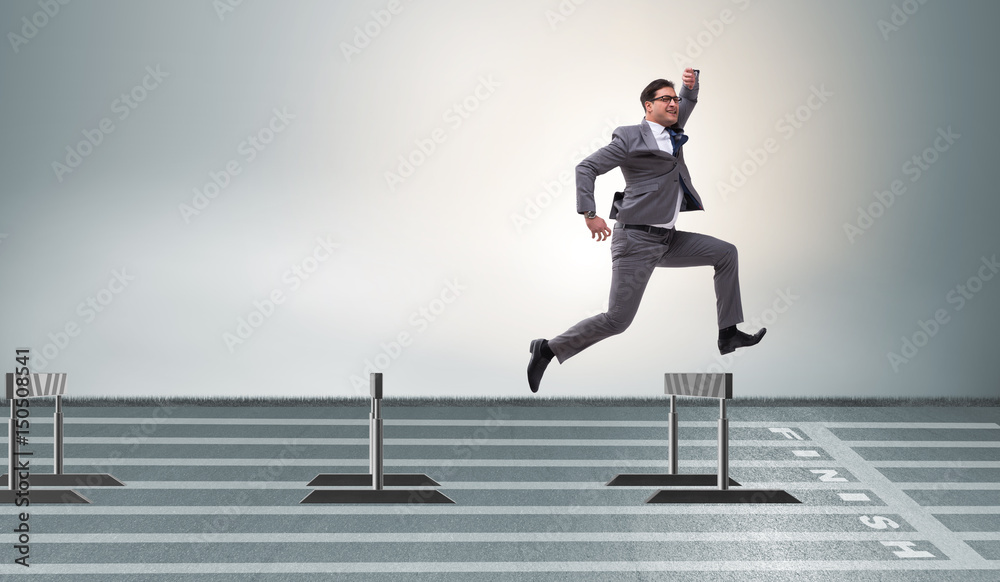 Αυτοκόλλητο Businessman jumping over barriers in business concept