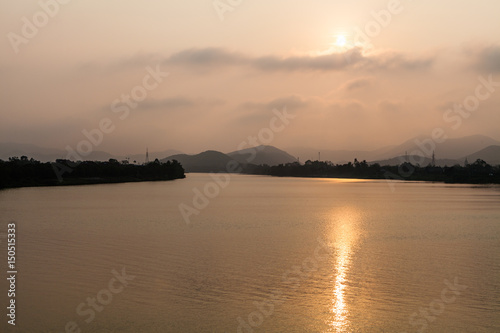 View from Thien Mu Pagoda to the sunset over Perfume River © lukszczepanski