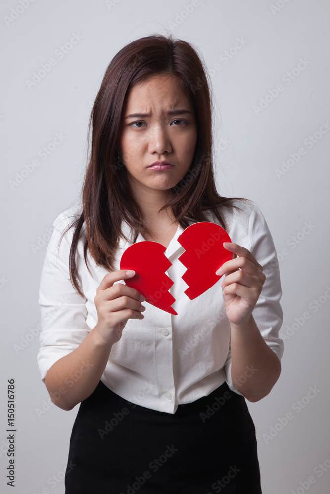 Beautiful young Asian woman with broken heart. Beautiful young Asian woman with broken heart.