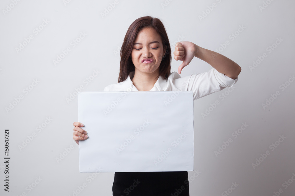 Young Asian woman show thumbs down with white blank sign. Young Asian woman show thumbs down with white blank sign.