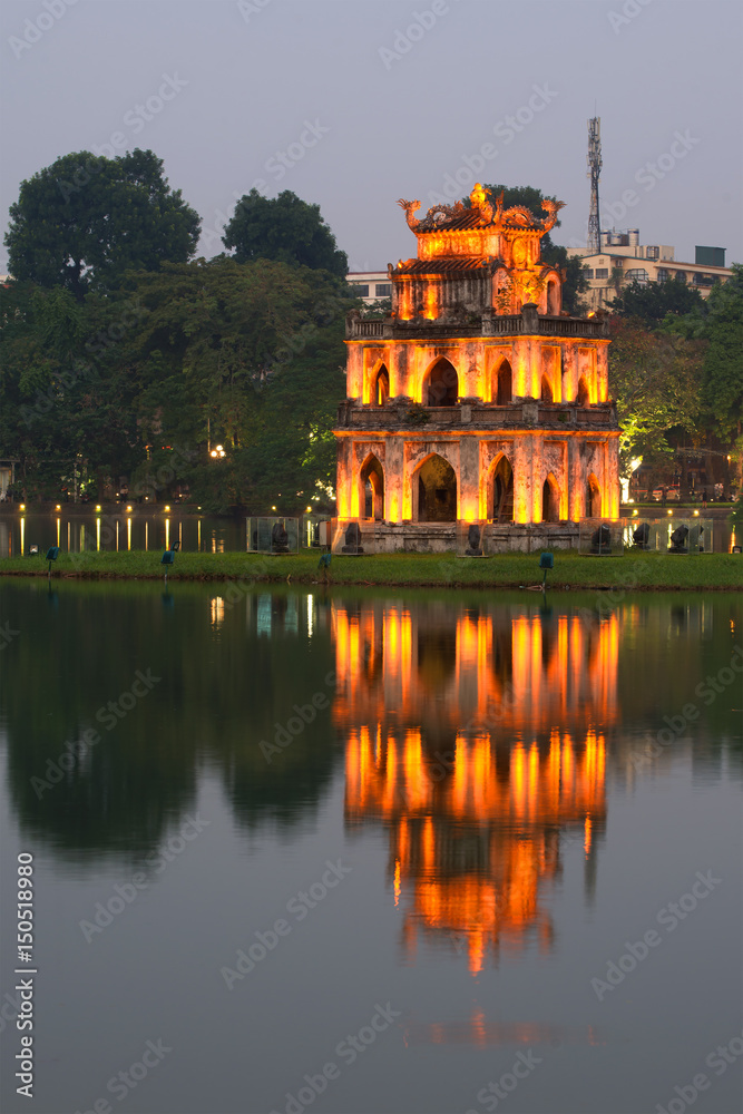 Turtle Tower on Hoan Kiem Lake in the evening twilight. Hanoi, Vietnam