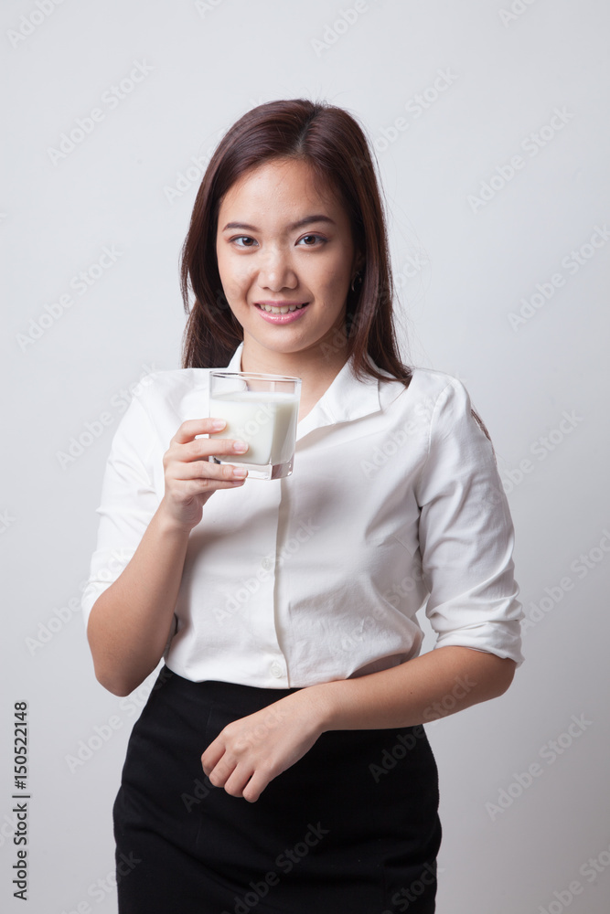 Healthy Asian woman drinking a glass of milk. Healthy Asian woman drinking a glass of milk.