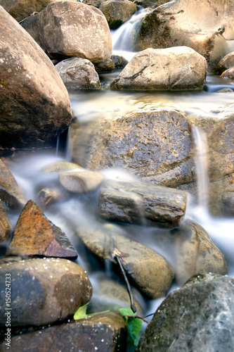 Long exposure of water running down a Putah Creek tributary in Winters, California, USA, after the particularly stormy winter of 2017