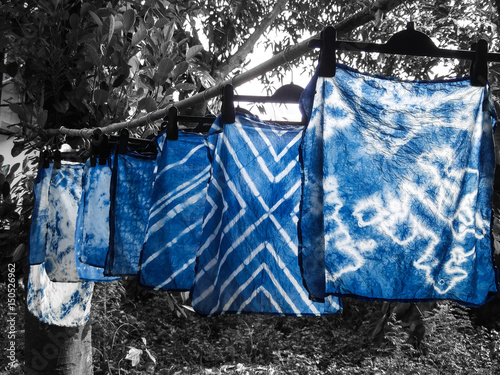 Beautiful natural indigo tie dye fabric with black and white background.