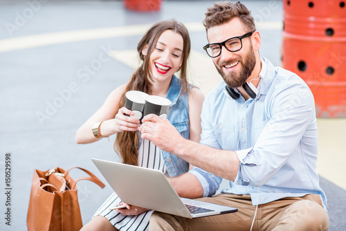 Business couple outdoors on the playground photo