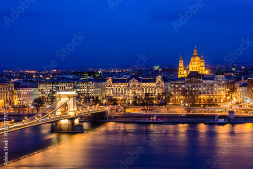 Aerial view of Budapest at night. Hungarian landmarks: Chain Bridge, St. Istvan's Basilica and Danube river in Budapest.