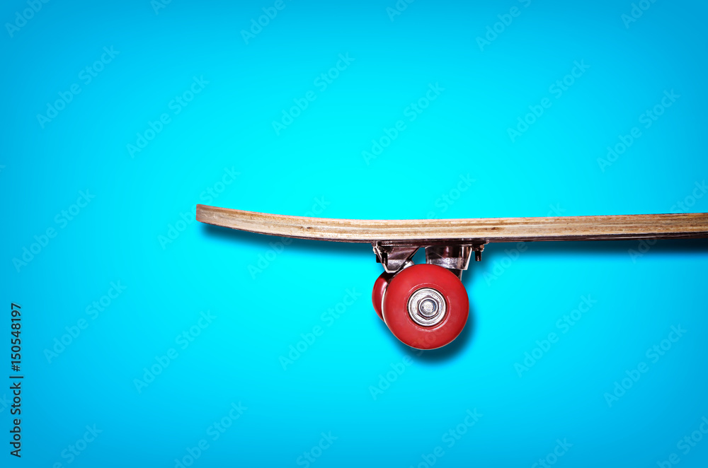 View of the skateboard on a blue background View of the skateboard on a blue background