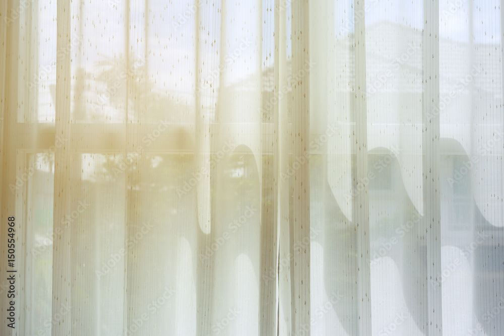 white drapery curtain hanging on the window white drapery curtain hanging on the window