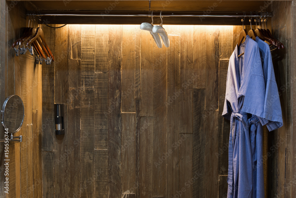 Blue twin bathrobe in wooden wardrobe of luxury hotel Blue twin bathrobe in wooden wardrobe of luxury hotel