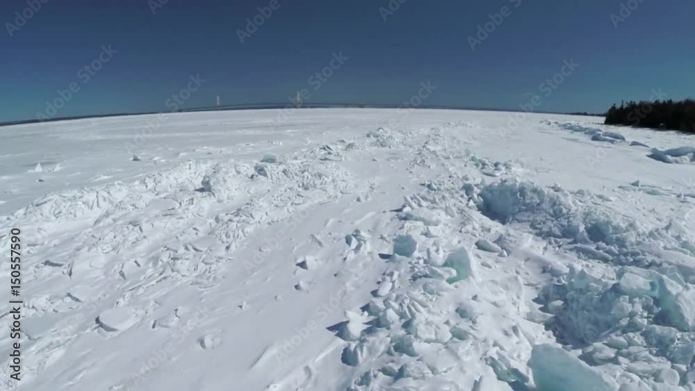 View of the mackinac bridge over ice and the line 5 pipeline View of the mackinac bridge over ice and the line 5 pipeline