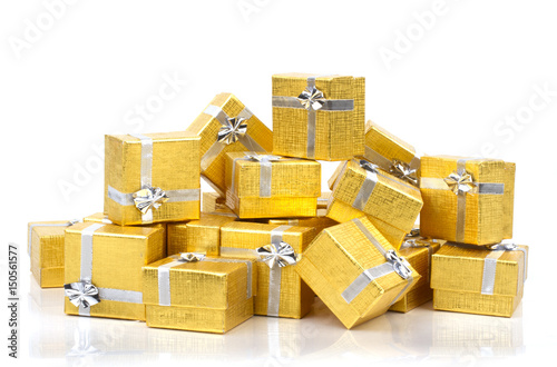A pile of gold gifts on white