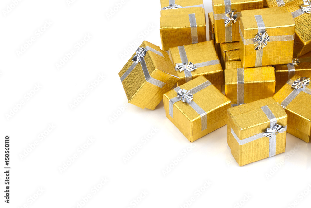 Close up of a pile of gold gifts on white Close up of a pile of gold gifts on white