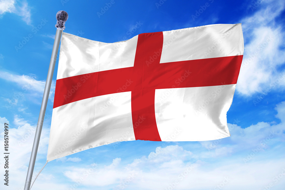 Flag of England developing against a clear blue sky