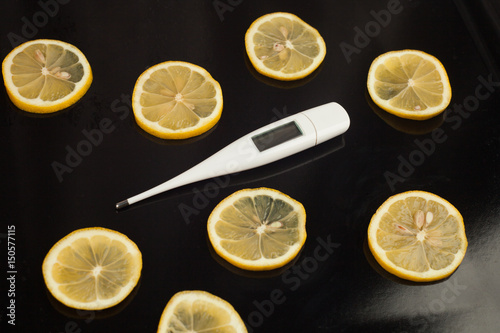 thermometer and the lemon - remedy for colds. health care, traditional medicine and flu concept. 