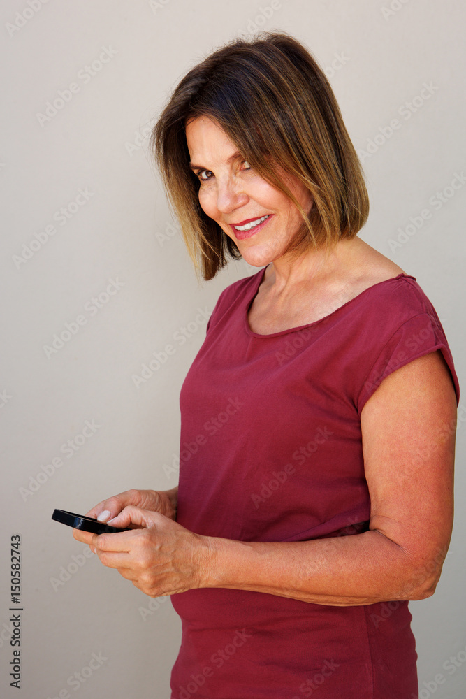 Fototapeta premium older woman holding mobile phone