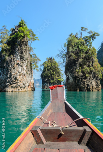 Limestone mountain ranges with long-tailed boat at Khao Sok National Park in Surat Thani Province, Thailand