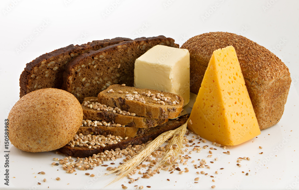 Various bread and cheese over a white background.
