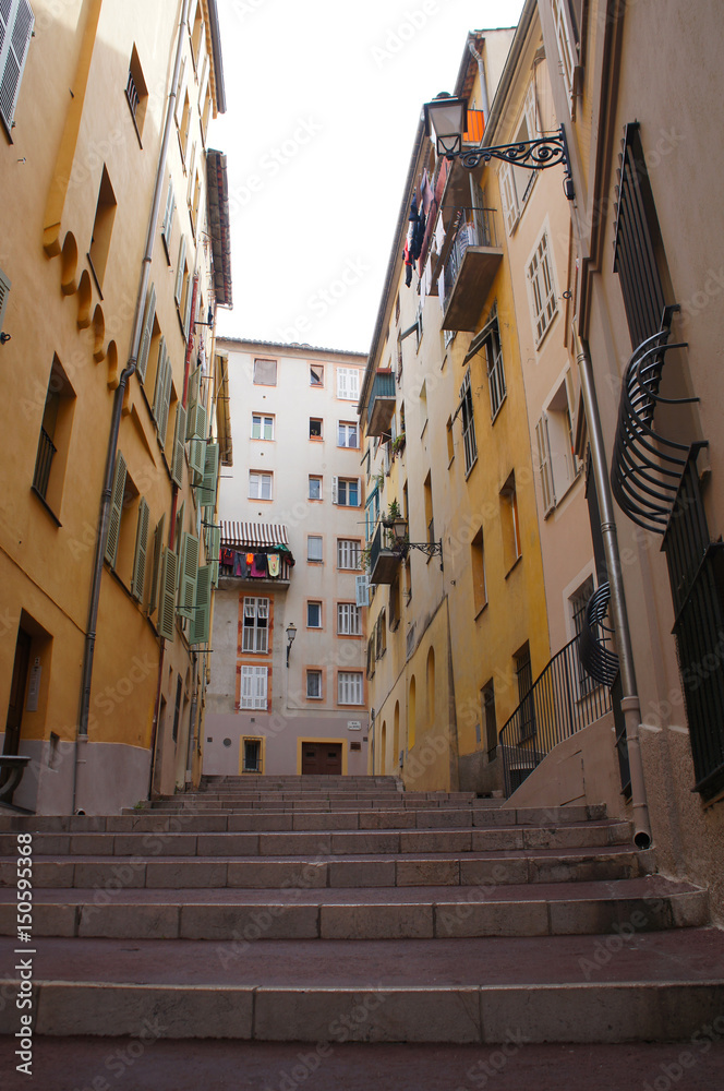 Old street with stairs of Nice city in France
