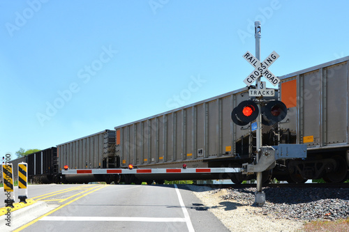 Canvas Print Freight train at crossing gate