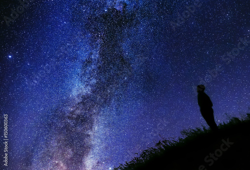 Lonely man watching the stars, different edit. Silhouette against the sky. Cygnus rift.