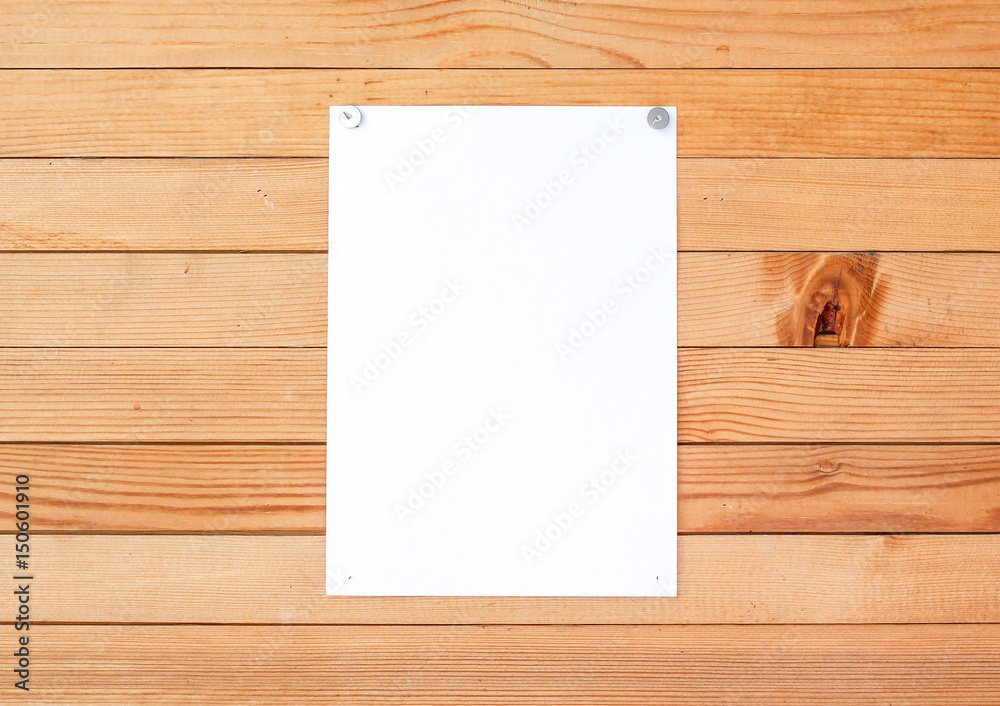 Empty paper ad loose leaves on a wooden wall. Attached metal buttons. Blank advertisement with cut slips Empty paper ad loose leaves on a wooden wall. Attached metal buttons. Blank advertisement with cut slips