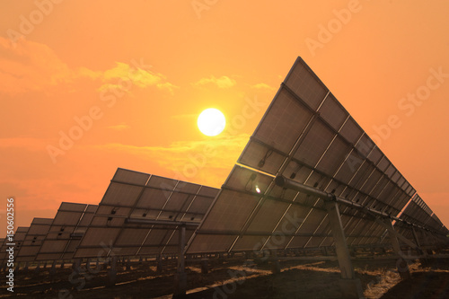 solar panels face sunlight with sky warm