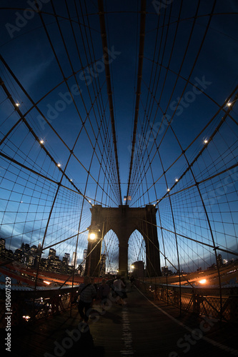 Closeup shot of New York City's Brooklyn Bridge at night. Shot with a fisheye lens during the Spring of 2017. photo