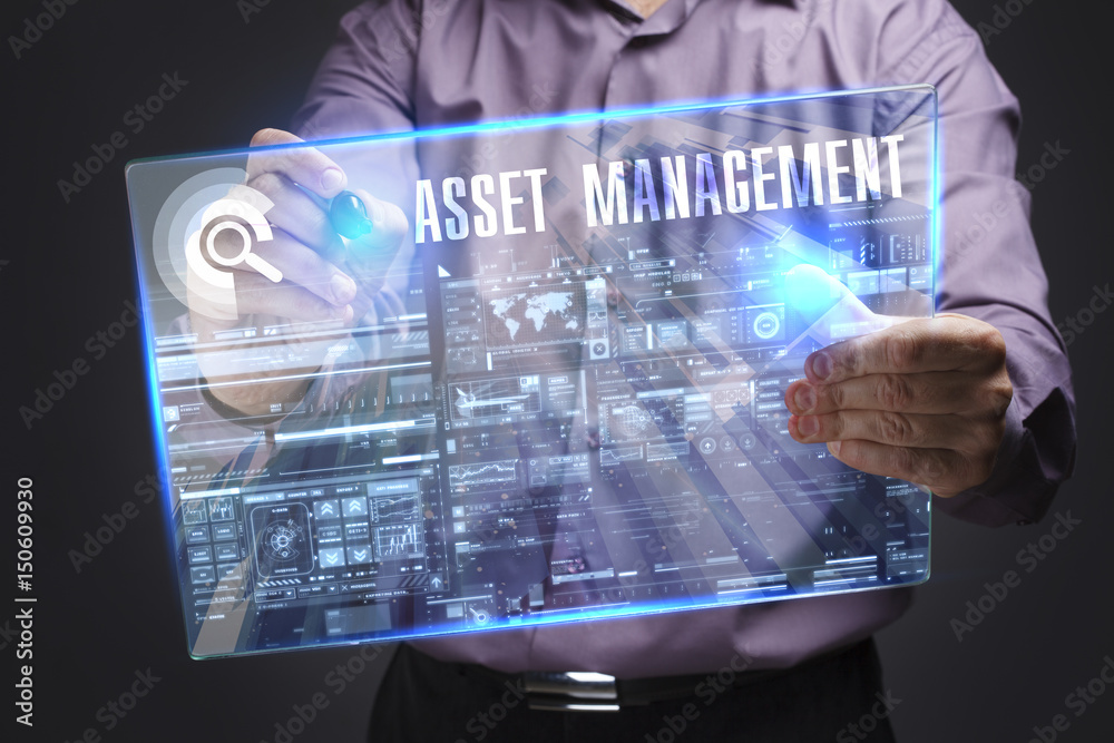 Business, Technology, Internet and network concept. Young businessman working on a virtual screen of the future and sees the inscription: Asset management Business, Technology, Internet and network concept. Young businessman working on a virtual screen of the future and sees the inscription: Asset management