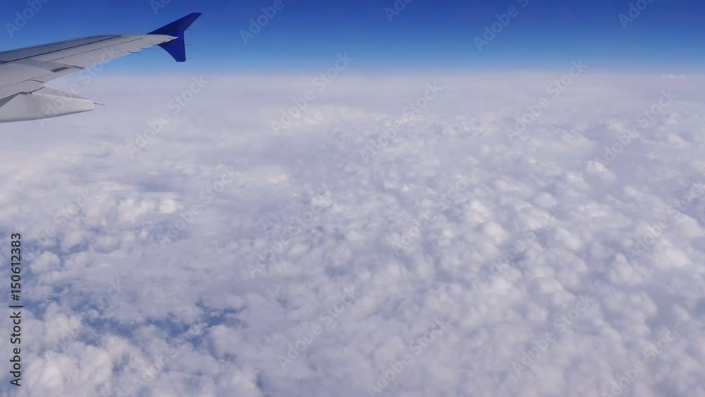 Wing of aircraft on the background of clouds and blue sky. Wing of aircraft on the background of clouds and blue sky.