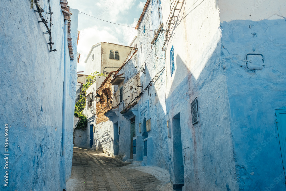 Vibrant blue coloured buildings. Chefchaouen street in Morocco, Africa