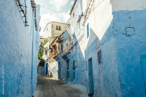 Vibrant blue coloured buildings. Chefchaouen street in Morocco, Africa © melecis