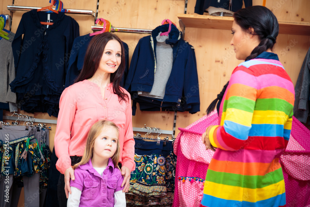 Obraz premium Mother And Daughter At Children's Store