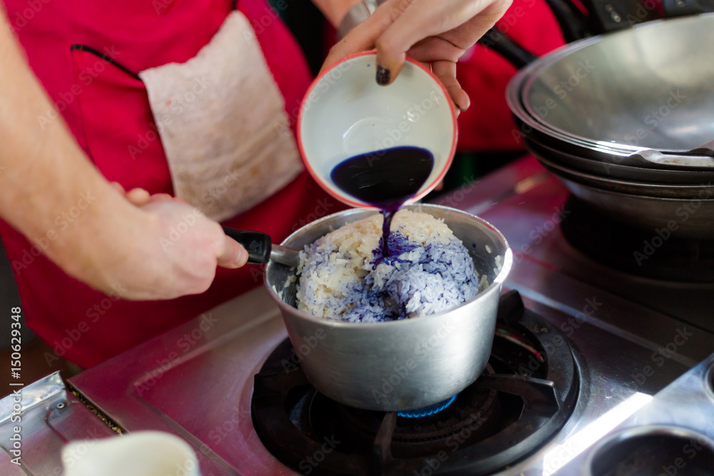 Preparing blue sticky rice