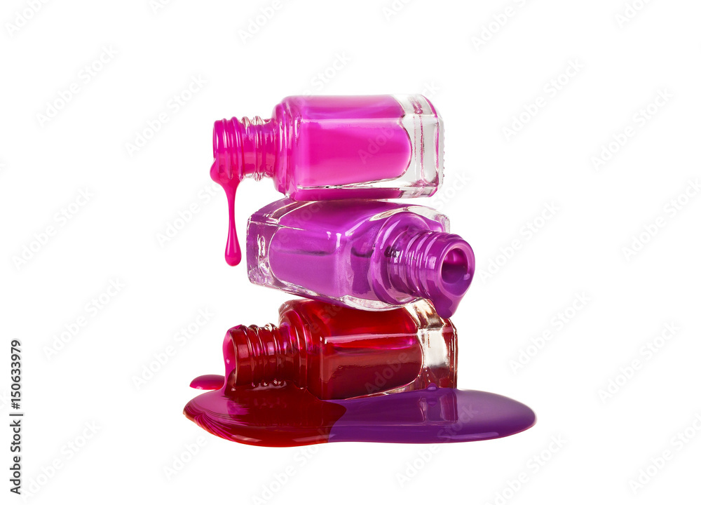 Nail polish dripping from stacked bottles isolated on white background Nail polish dripping from stacked bottles isolated on white background