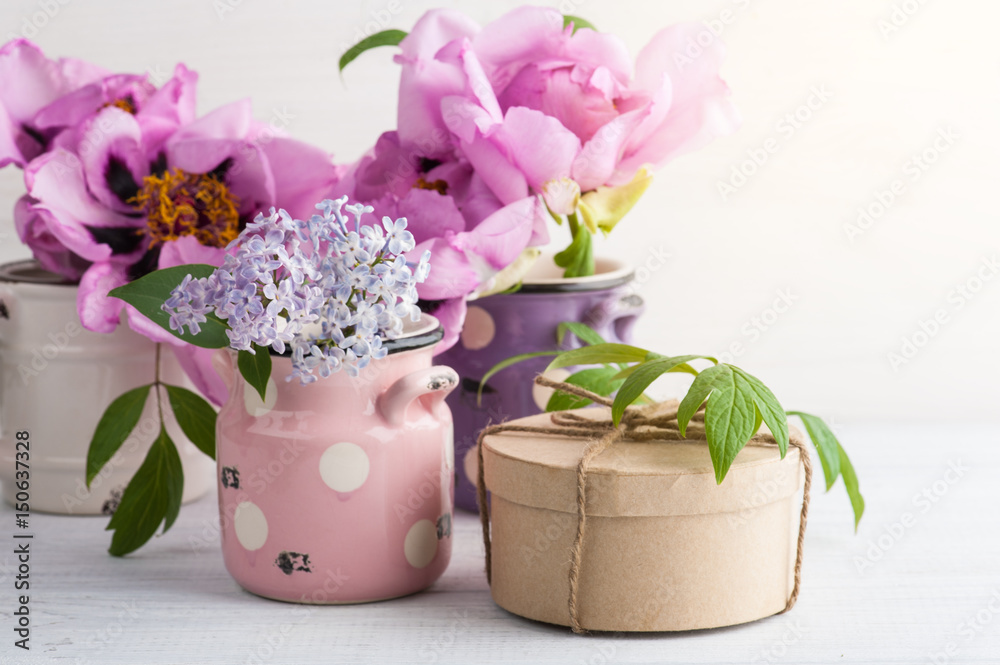 Kraft gift box, peonies and lilac flowers Kraft gift box, peonies and lilac flowers