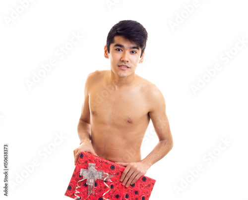 Undressed young man holding present