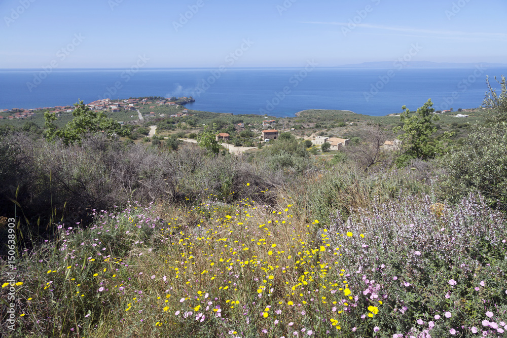 view over agios nicolaos with blue sea and sky in Mani on peloponnese on sunny day in spring